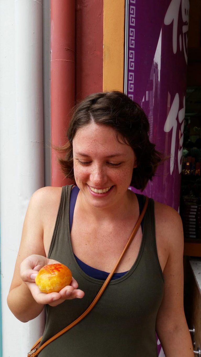 Natalie holding food in Singapore